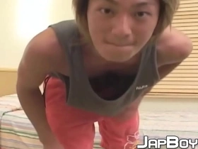 A Japanese jock with a flawless derriere pleases himself, stroking his massive member with fervor. His blonde hair adds allure as he reaches climax, releasing his essence in a powerful ejaculation. Hardcore gay delight awaits.