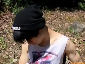 A cute Asian twink enjoys the outdoors as he pleasures himself with anal beads, creating a sensual solo scene that will leave you breathless. Watch him explore his desires and reach ecstasy.