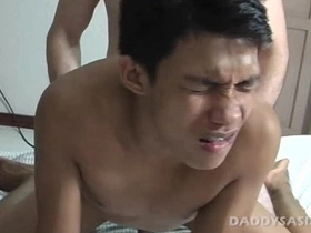 Benjie, a kinky Asian twink, gets ticklish delight from Daddy's foot massage before eagerly sucking and fucking. The climax? A hot load shot right onto his tongue.