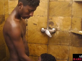 Slim African dude gets his shower time interrupted by a hot gay dude. He eagerly sucks his cock, then gets his ass pounded doggystyle, leading to a messy, explosive finish.