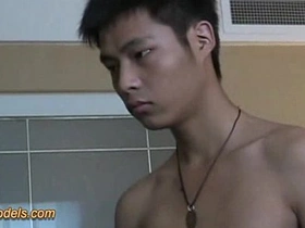A slender Asian twink with a smooth body and an average cock teases and strokes himself to a satisfying climax, culminating in a messy release. His lean physique and cute face make for an irresistible gay Asian jerk-off session.