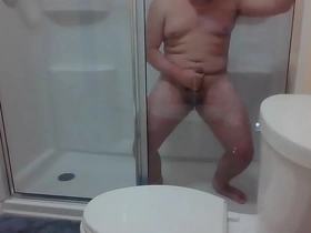 A young Asian guy indulges in self-pleasure, stroking his big cock in a hotel shower. His chubby frame and big ass add to the allure as he reaches climax. This gay amateur video showcases his anal play and intense cumshot.