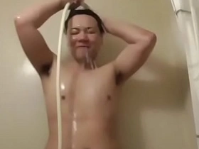 Famous Japanese gay boy, Simoyaka, in a steamy shower scene. His chiseled body, glistening under the hot water, is a sight to behold. A must-watch for fans of Japanese gay content.