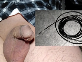 Curious Japanese guy tests UV camera to explore his peehole. Surprised to find unknown objects near urethra. Tries fiber scorp to remove, but micro scorp gets stuck, leading to intense, risky retrieval.