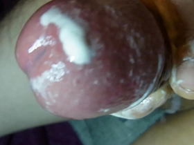 As I stroked my big Japanese cock, my cum shot splattered all over the place. Closeup of my glans erupts in a hot, gooey load. Wanking off is always worth it.