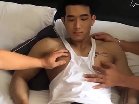 A sizzling Vietnamese gay model captivates with his enticing physique, teasingly revealing every inch of his chiseled abs and firm ass, leaving viewers craving more.