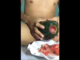 During a steamy livestream, a Vietnamese hunk teases his cock with a cucumber, building up to a hot load. Viewers eagerly await his explosive climax.