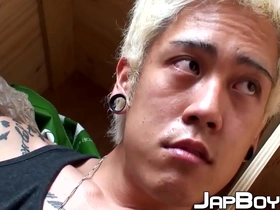 Blond Japanese twink flaunts his skills in a solo scene, teasing his hole with fingers and stroking his big cock. His moans intensify as he reaches a powerful climax, leaving him breathless and satisfied.
