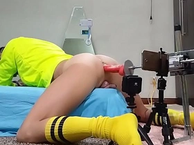 Asian guy craves yellow delight, wielding a massive dildo. His tight hole devoured by the toy, he moans in ecstasy as his ass is ravished, his body writhing in pleasure.